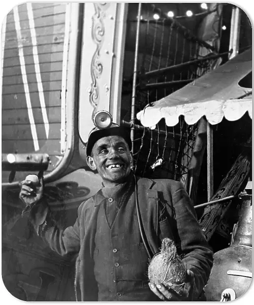 Miner at a fairground, Conisbrough, near Doncaster, South Yorkshire, 1955. Artist