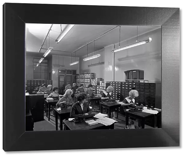 Tabulating machines in the punch room in a Sheffield Factory office, 1963. Artist