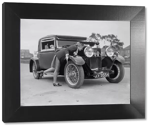 Kitty Brunell looking under the bonnet of a Talbot 14  /  45 sportsmans coupe, c1928