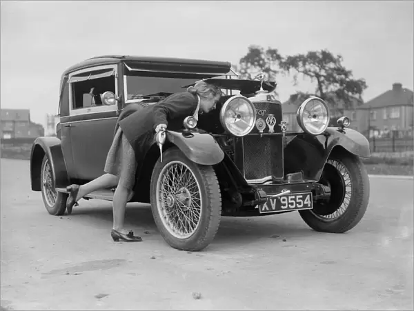 Kitty Brunell looking under the bonnet of a Talbot 14  /  45 sportsmans coupe, c1928