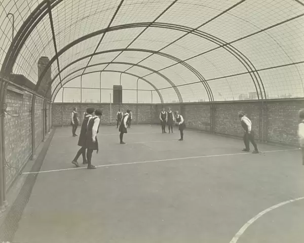 Girls playing netball on a roof playground, Barrett Street Trade School, London, 1927