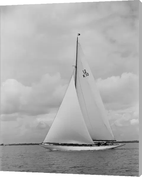 Trivia, a 12 Metre class yacht sails close-hauled, 1939. Creator: Kirk & Sons of Cowes
