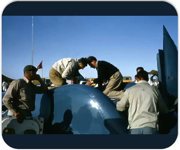 Mechanics working on Bluebird CN7 for World Land speed record attempt, Lake Eyre, 1964