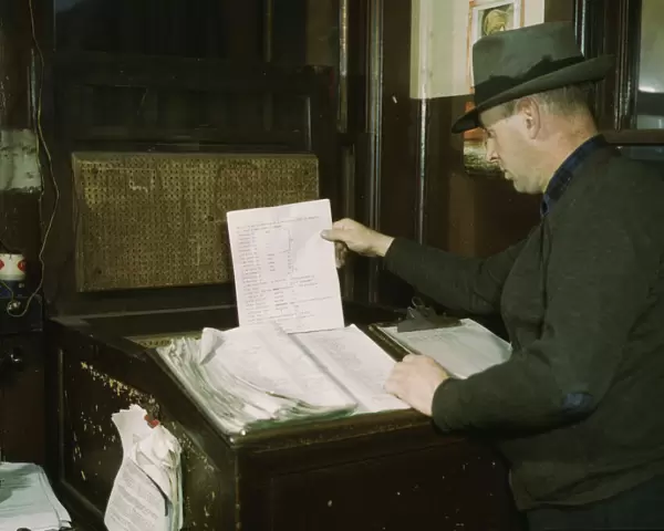 Switch lists coming in by teletype to the hump office at a C& NW RR yard, Chicago, Ill. 1942. Creator: Jack Delano