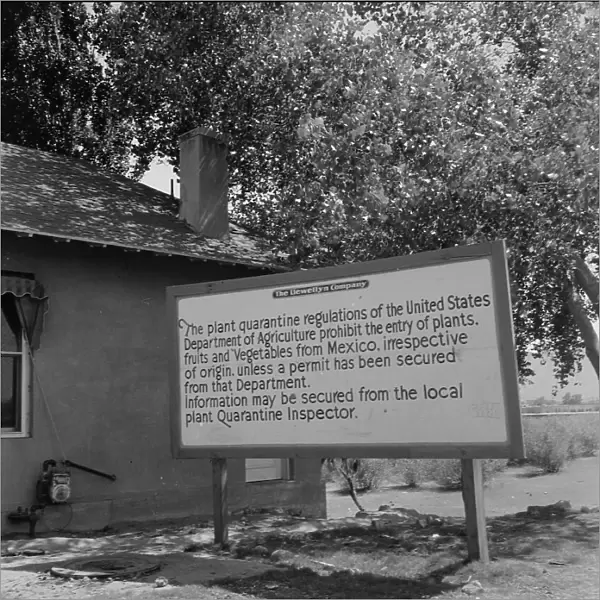Sign at bridge between Juarez, Mexico and El Paso, Texas, 1937. Creator: Dorothea Lange