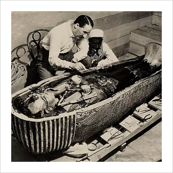 Howard Carter with Coffin of Tutankhamun, 1925. Creator: Burton, Harry (1879-1940)