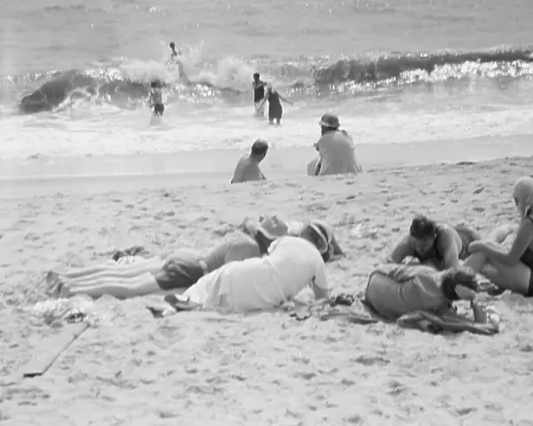 Unidentified group of people, possibly members of the Jewett family, at the beach, c1911-1942. Creator: Arnold Genthe