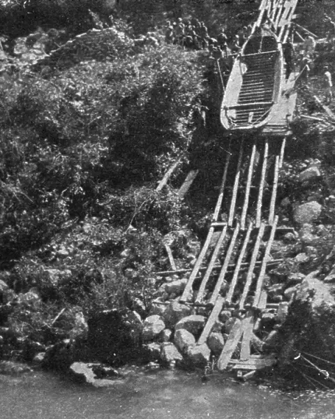Italian Offensive of the Isonzo; Boats are lowered on a slide of the riverbank escarpment, 1917. Creator: Unknown
