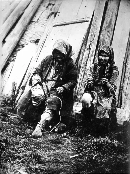 Tutur Tungus. Dudovka camp. Old women twist threads from deer tendons, 1920-1939. Creator: Unknown