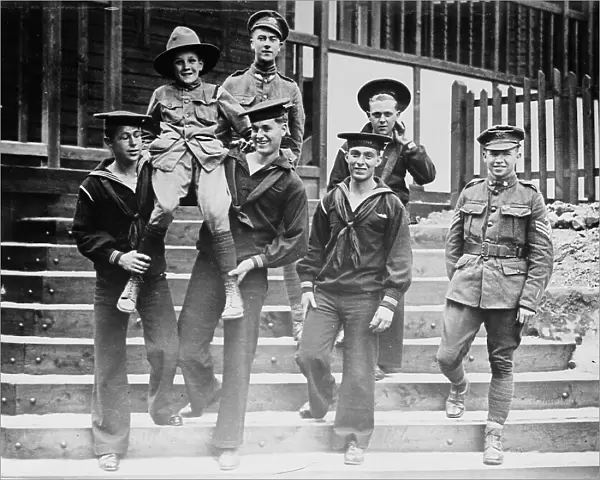 Digby Morton, Phila. Boy Scout, and U.S. Jackies at 'Eagle' hut in London, between c1915 and 1918. Creator: Bain News Service. Digby Morton, Phila. Boy Scout, and U.S. Jackies at 'Eagle' hut in London, between c1915 and 1918