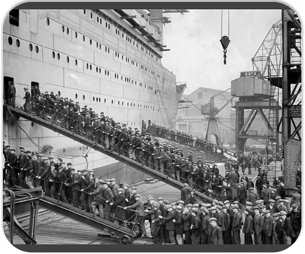 Workers board the Queen Mary