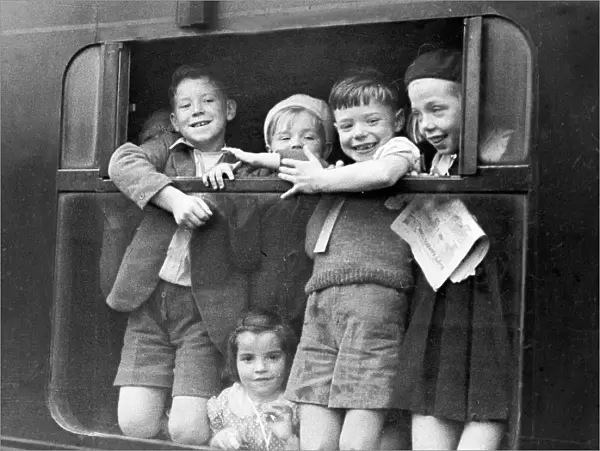Children waving while being evacuated