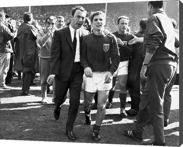 Jimmy Greaves puts an arm round the exhausted Alan Ball