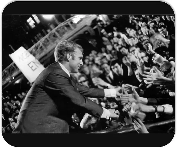 England captain, Bobby Moore, shakes hands with jubilant supporters at the World Cup celebrations