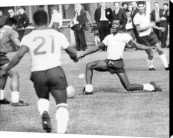 Denilson passes the ball to Pele during Brazilian football team training session for the 1966 World Cup