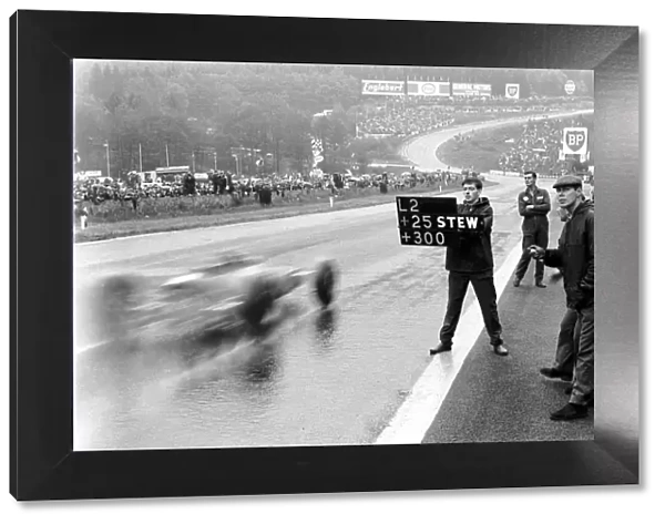 Formula One World Championship: Pit signal to Jim Clark Lotus, saying he is 25 secs ahead of Jackie Stewart in 2nd place with the rest of the