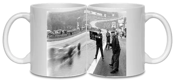 Formula One World Championship: Pit signal to Jim Clark Lotus, saying he is 25 secs ahead of Jackie Stewart in 2nd place with the rest of the
