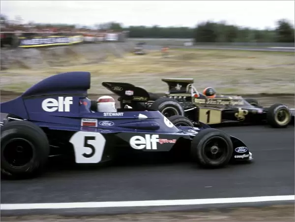 Formula One World Championship: Third placed Emerson Fittipaldi Lotus 72D holds off the race winner Jackie Stewart Tyrrell 006  /  2 as they approach