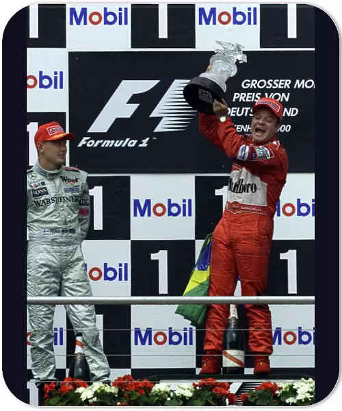 Formula One German Grand Prix Rubens Barrichello celebrates with Mika Hakkinen Hockenheim, 30-07-2000 World Steve Etherington  /  LAt Photographic