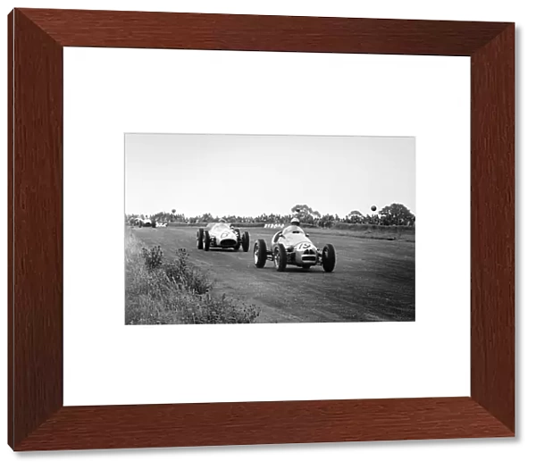 1954 British Grand Prix. Silverstone, Great Britain. 17 July 1954. Andre Pilette, Gordini 16, 9th position, leads 'B Bira', Maserati 250F, retired, action. World Copyright: LAT Photographic Ref: Autosport b&W print