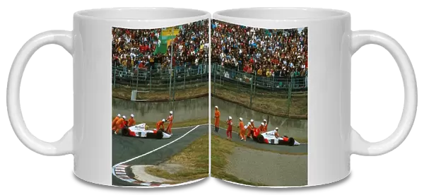 Formula One World Championship: Team-mates Ayton Senna and Alain Prost McLaren MP4  /  5, crash out of the race
