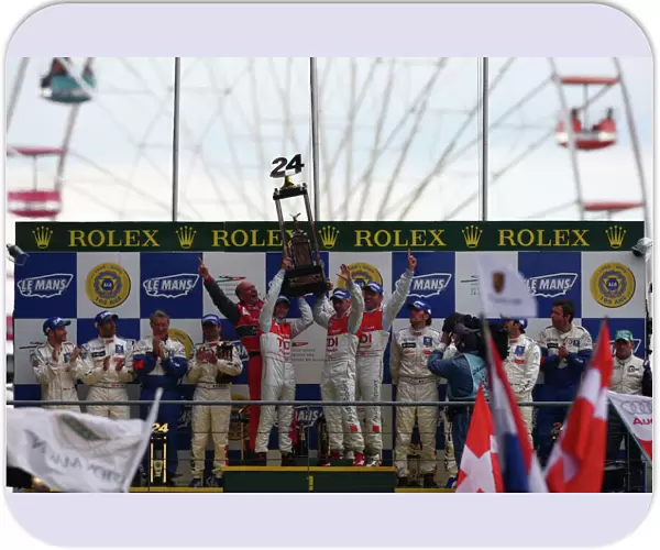2008 Le Mans 24 Hours: Rinaldo Capello  /  Allan McNish  /  Tom Kristensen, no 2 Audi R10 TDI, lift the trophy on the podium. Portrait. Podium