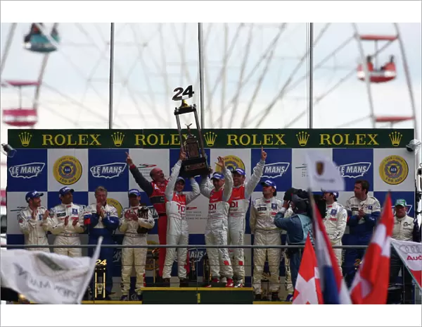2008 Le Mans 24 Hours: Rinaldo Capello  /  Allan McNish  /  Tom Kristensen, no 2 Audi R10 TDI, lift the trophy on the podium. Portrait. Podium