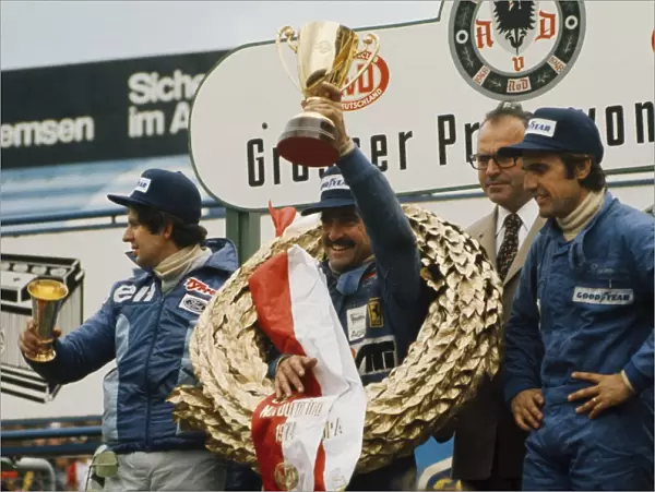 1974 German Grand Prix - Podium: Clay Regazzoni, 1st position, Jody Scheckter, 2nd position and Carlos Reutemann, 3rd position, celebrate on the podium
