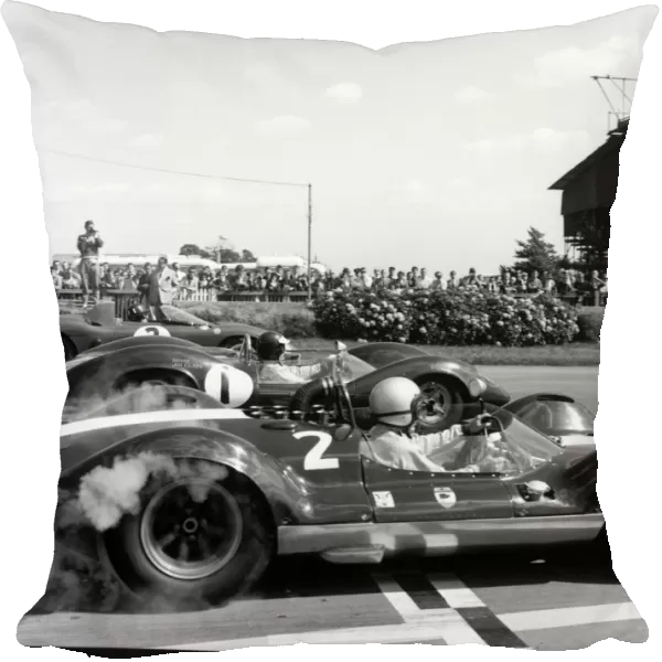1964 Tourist Trophy: Bruce McLaren retired, Jim Clark, 12th position and Graham Hill, 1st position, on the start line, action