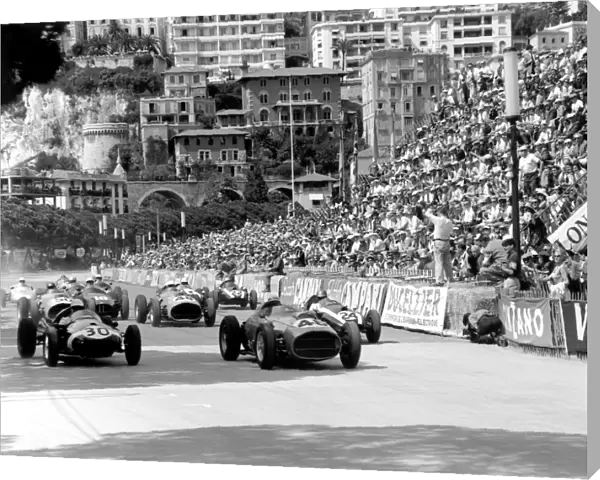 1959 Monaco Grand Prix: Stirling Moss, #30 Cooper T51-Climax, retired, and Jean Behra, #46 Ferrari Dino 246, retired, lead Tony Brooks, #50 Ferrari Dino 246