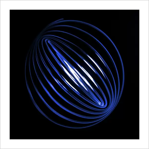 Blue Light Curving Into A Sphere Shape Against A Black Background