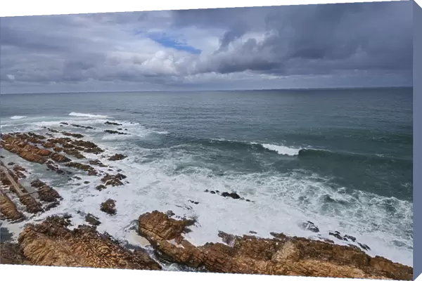 View from Cape St Blaize Lighthouse of the rocky shore and Atlantic Ocean, Mossel Bay, South Africa