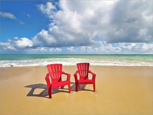 NA. Red Beach chairs beckon. Baldwin Beach. North coast of Maui near Paia town. Hawaii