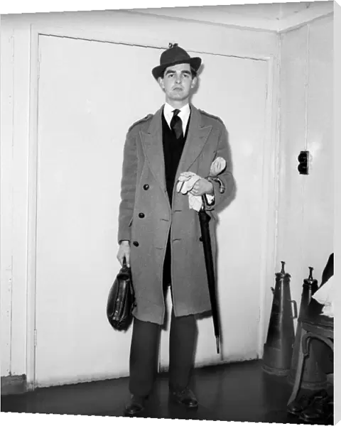 Actor Derek Nimmo dressed as a city gent. March 1957