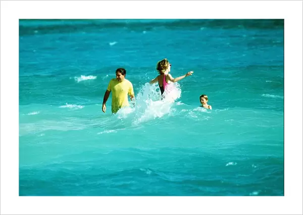 Princess Diana with her sons Prince William and Prince Harry take a swim in the sea with