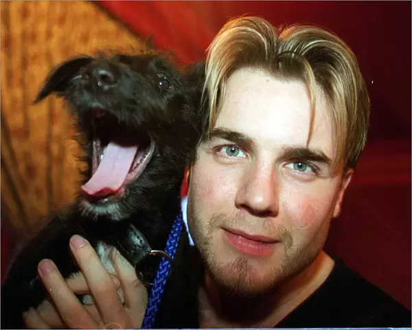 Gary Barlow with puppy Rocky, March 1998. Won by Fariha Ali as part of an Atlantic