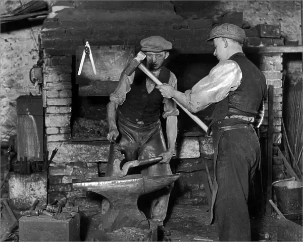 Smiths at work in the 100-year-old blacksmiths shop owned by James Luke