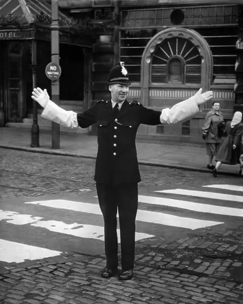 P. C. Gibbs of the Manchester Police seen here on crossing patrol on the day he retires