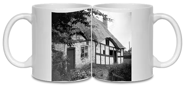 Thatched roof cottage of Izaak Walton in the village of Shallowford July 1923 Alf