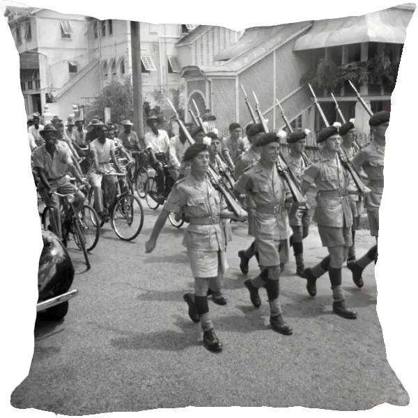 British soldiers marching in Georgetown, British Guiana watched by local citizens