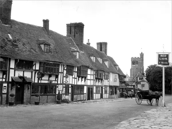 General view of the main street in the village of Biddenden in Kent showing pubs