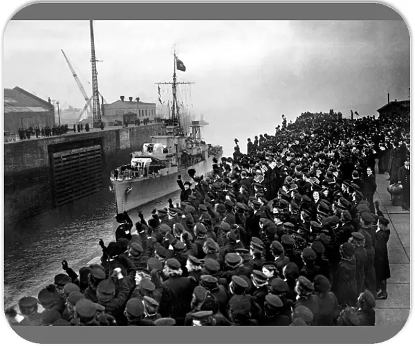 Cheering sailors and Wrens of the Royal Navy line the entrance to Gladstone dock in