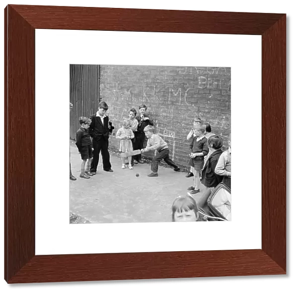Children of the tenement blocks of Govan, Glasgow seen here playing a game of street