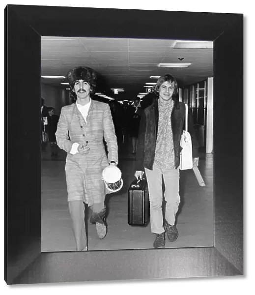 George Harrison and Beatles associate Alexis Mardis (aka Magic Alex) at London Airport