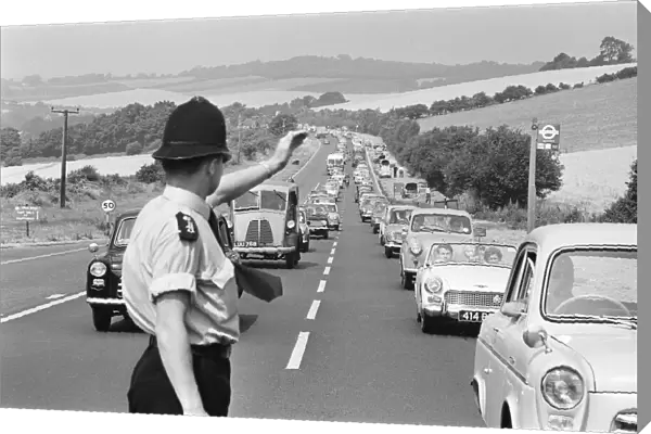 Policeman directing August Bank Holiday taffic on the A20