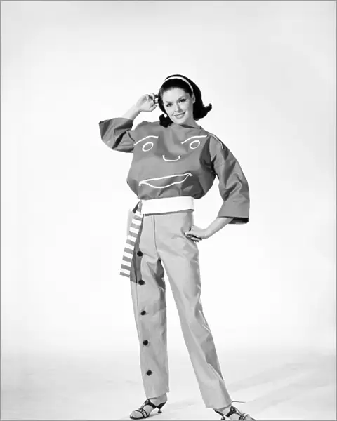 Clothing: Fashion: Woman wearing funny face trouser suit. 1964 B1723a-001