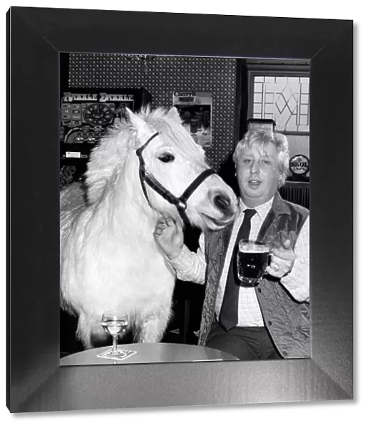 Horse trainer Trevor Simmons with Dimples the horse at the local pub. March 1985
