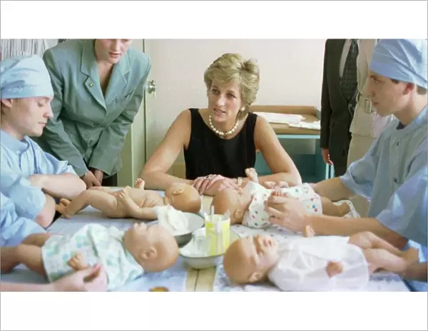 Diana, Princess of Wales, pictured with nurses in the baby care unit at the Tushinskaya