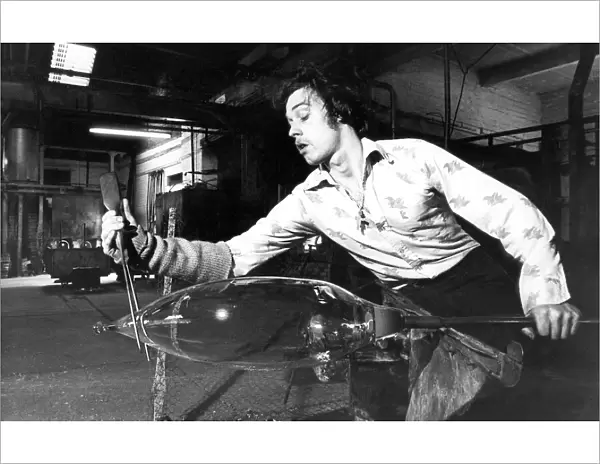 A glass blower at Hartley Wood in Sunderland making stained glass lighting for