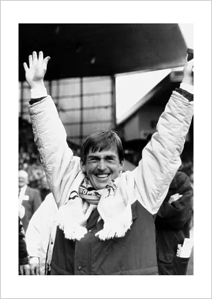 Kenny Dalglish manager Liverpool FC with arms in the air raised scarf around neck